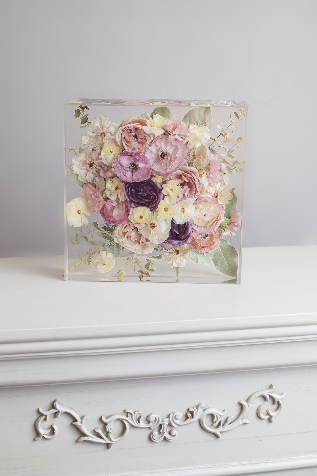 12" square resin floral preservation displayed on shelf