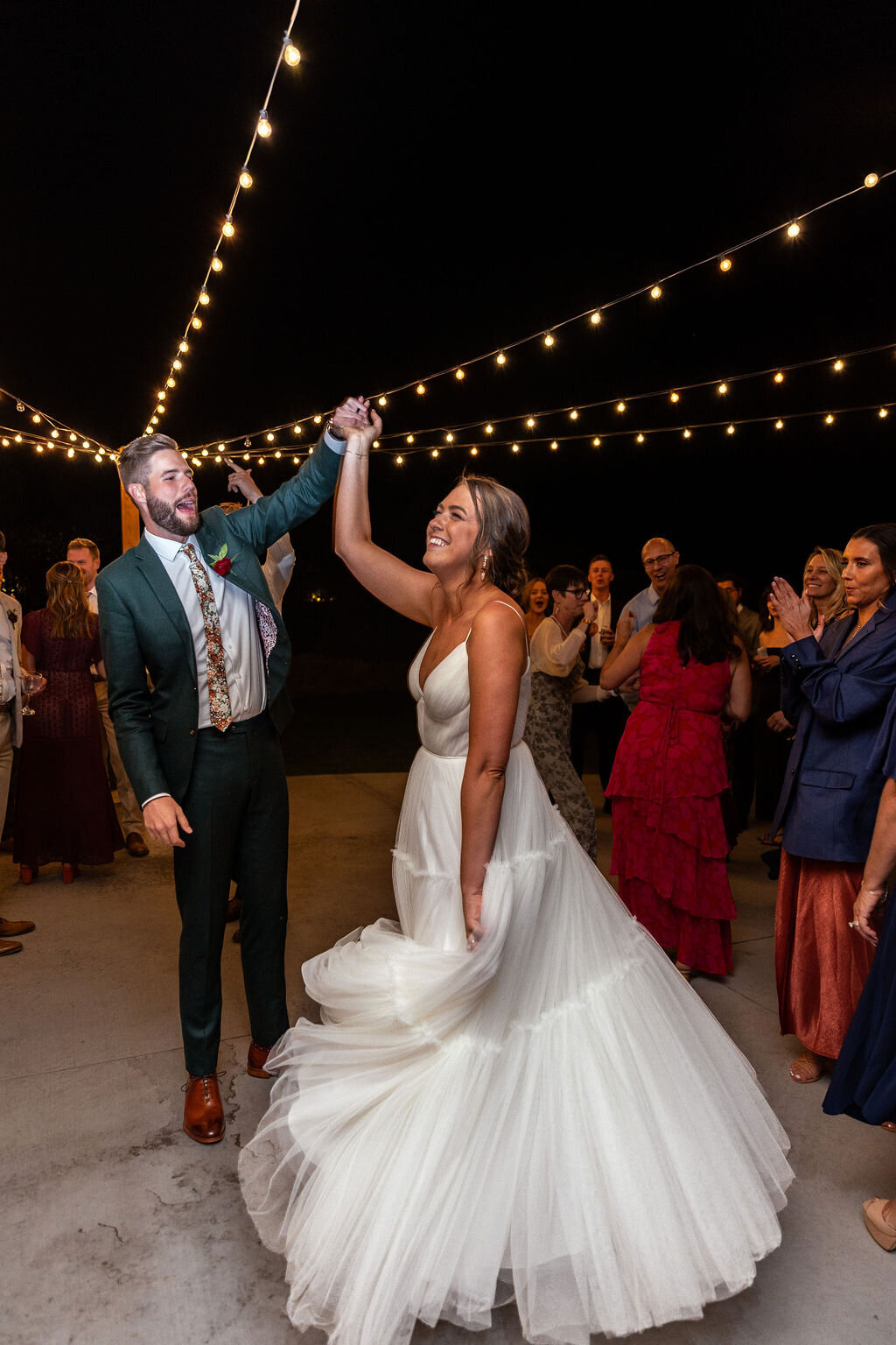 Bride and groom celebrate after their first dance.