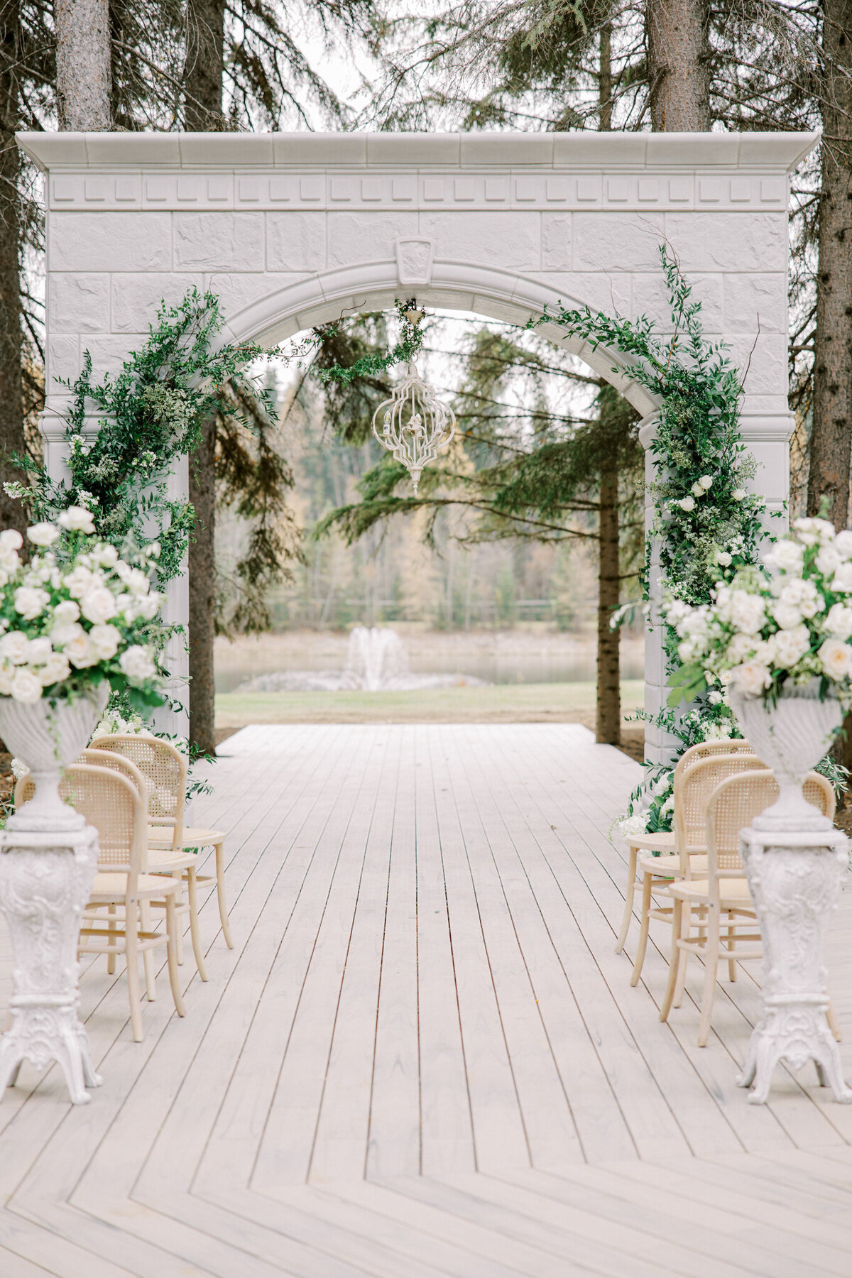 Stunning outdoor ceremony space at Archway Manor Weddings & Events, elegant, timeless, European-inspired Red Deer, Alberta wedding venue, featured on the Brontë Bride Vendor Guide.