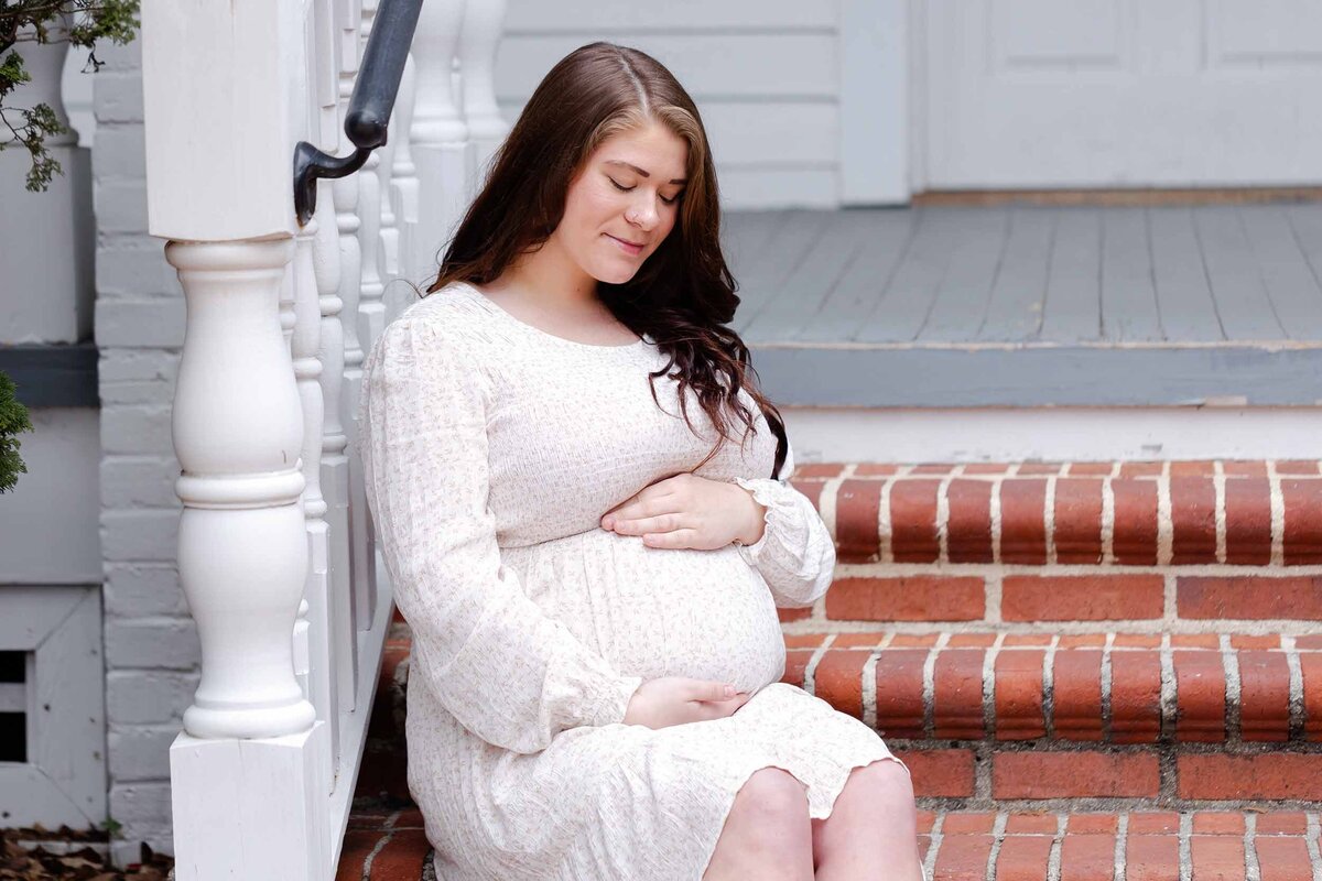 mom in white dress expecting her first child  in Lexington, SC