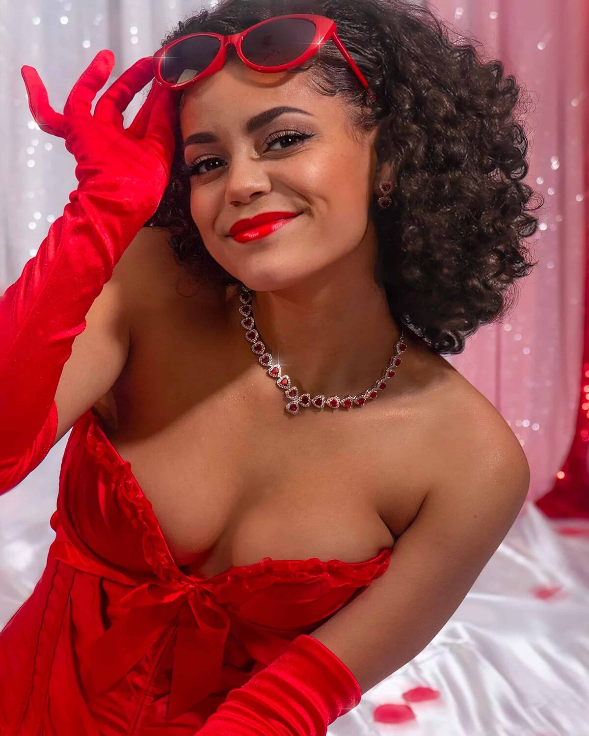 Valentine lady in red teddy red gloves smiling 