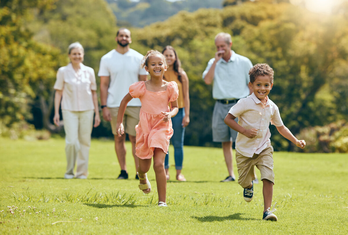 Happy family with multiple generations playing outside