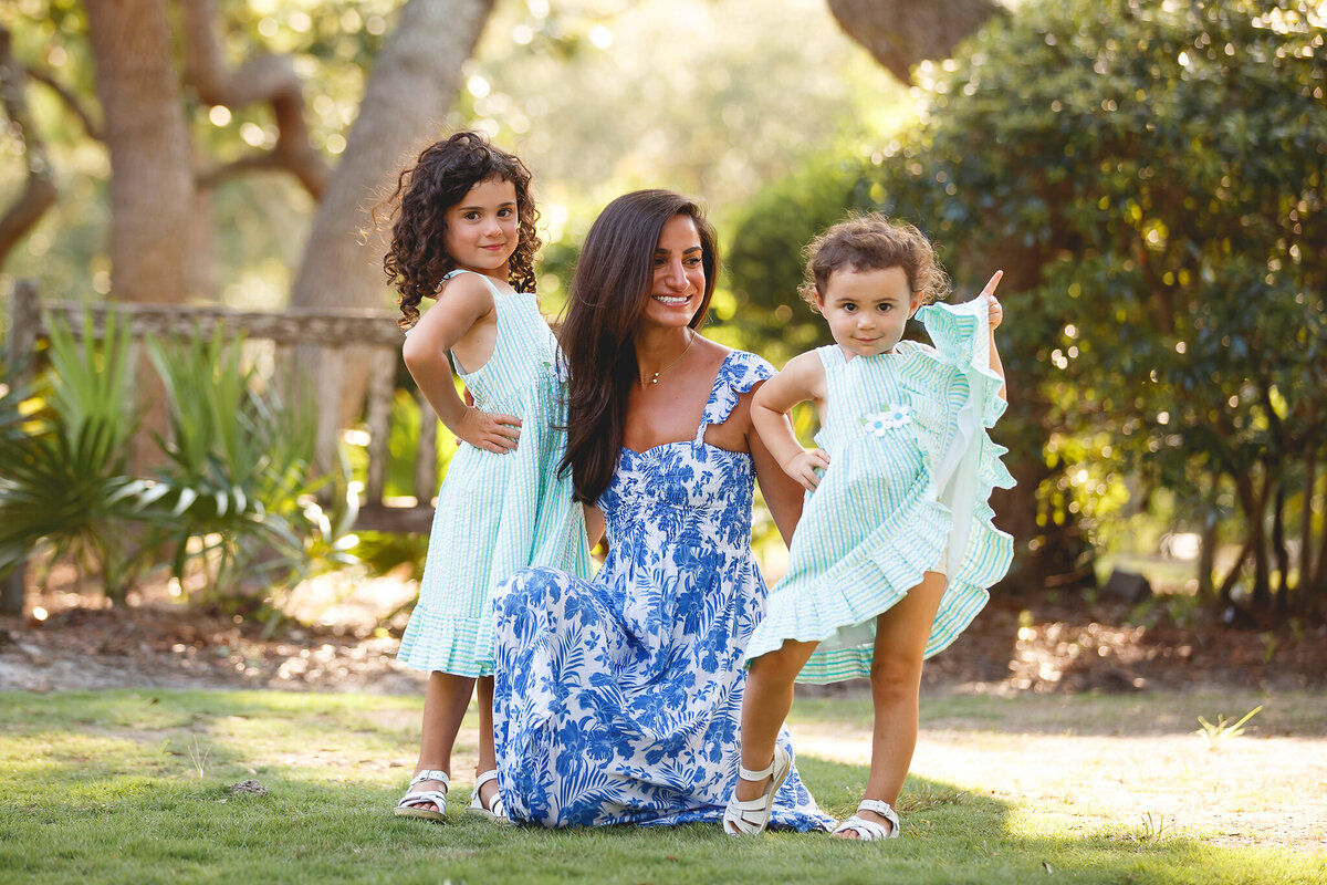 toddler with attitude posing for family portrait at Watercolor