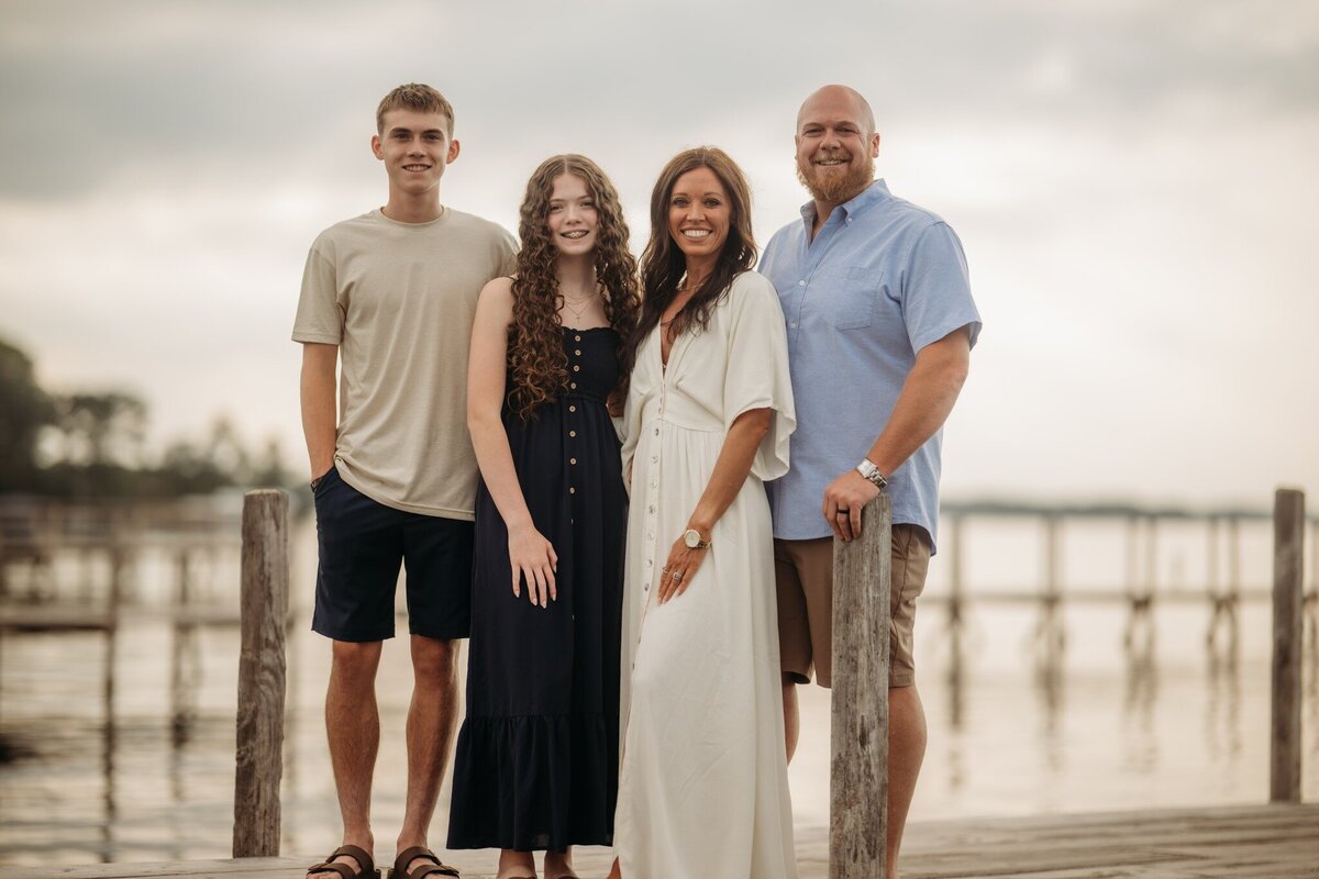 Functional Nutrition Coach Kenzie Mosher spending time outside with her husband and children, reflecting her belief that health supports family, happiness, and balance.