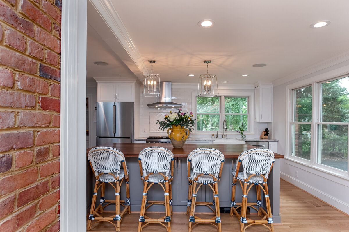 addition kitchen with large grey island serena and lily barstools-1