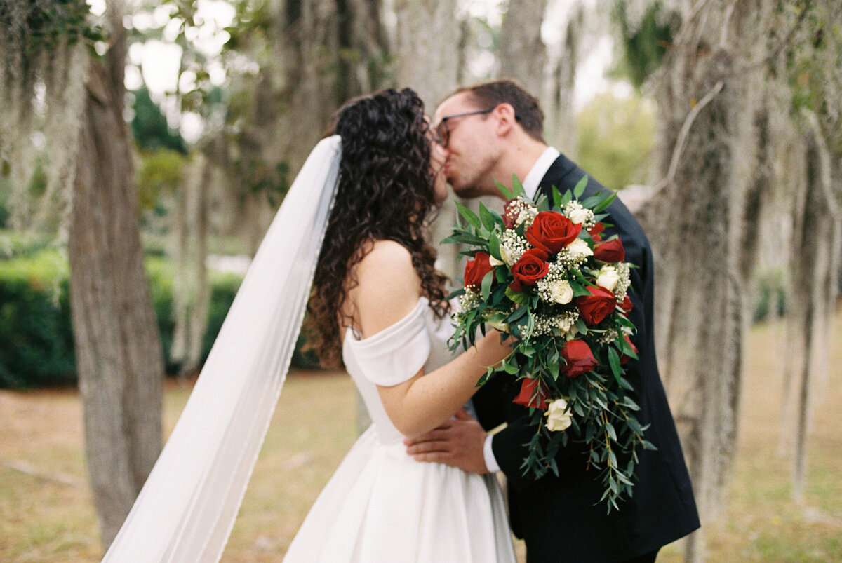 couple kissing on 35mmfilm wedding in florida