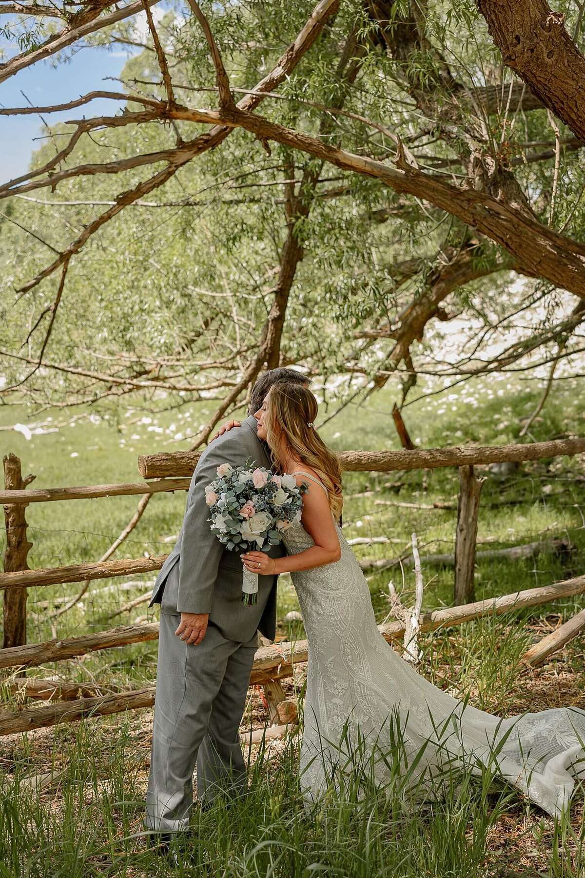 Bride gives her dad a hug after he see's her in her bridal attire. Michelle Betz Photograpraphy