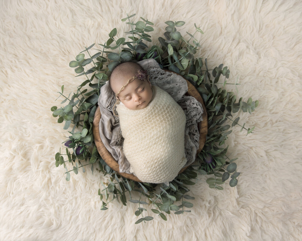 New Jersey portrait photographer takes pictures of  baby sleeping during newborn photography shoot.