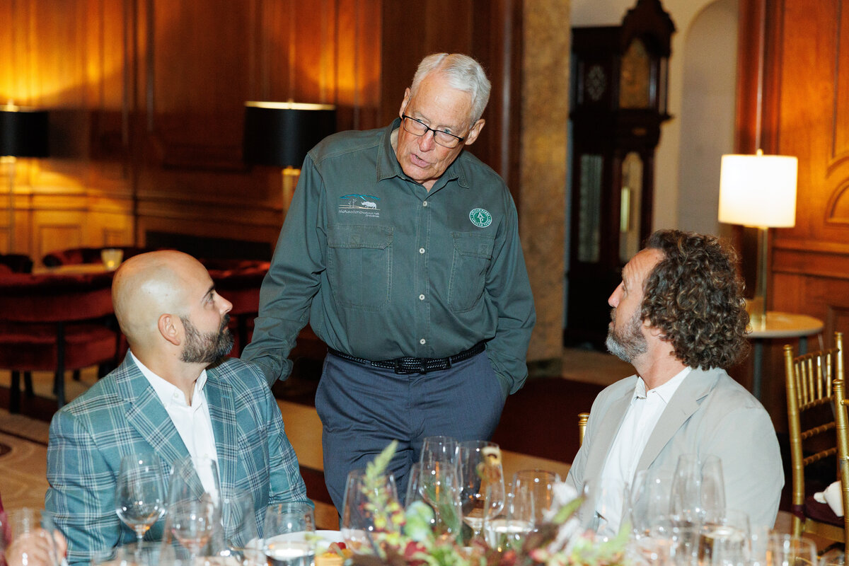 Three males talking