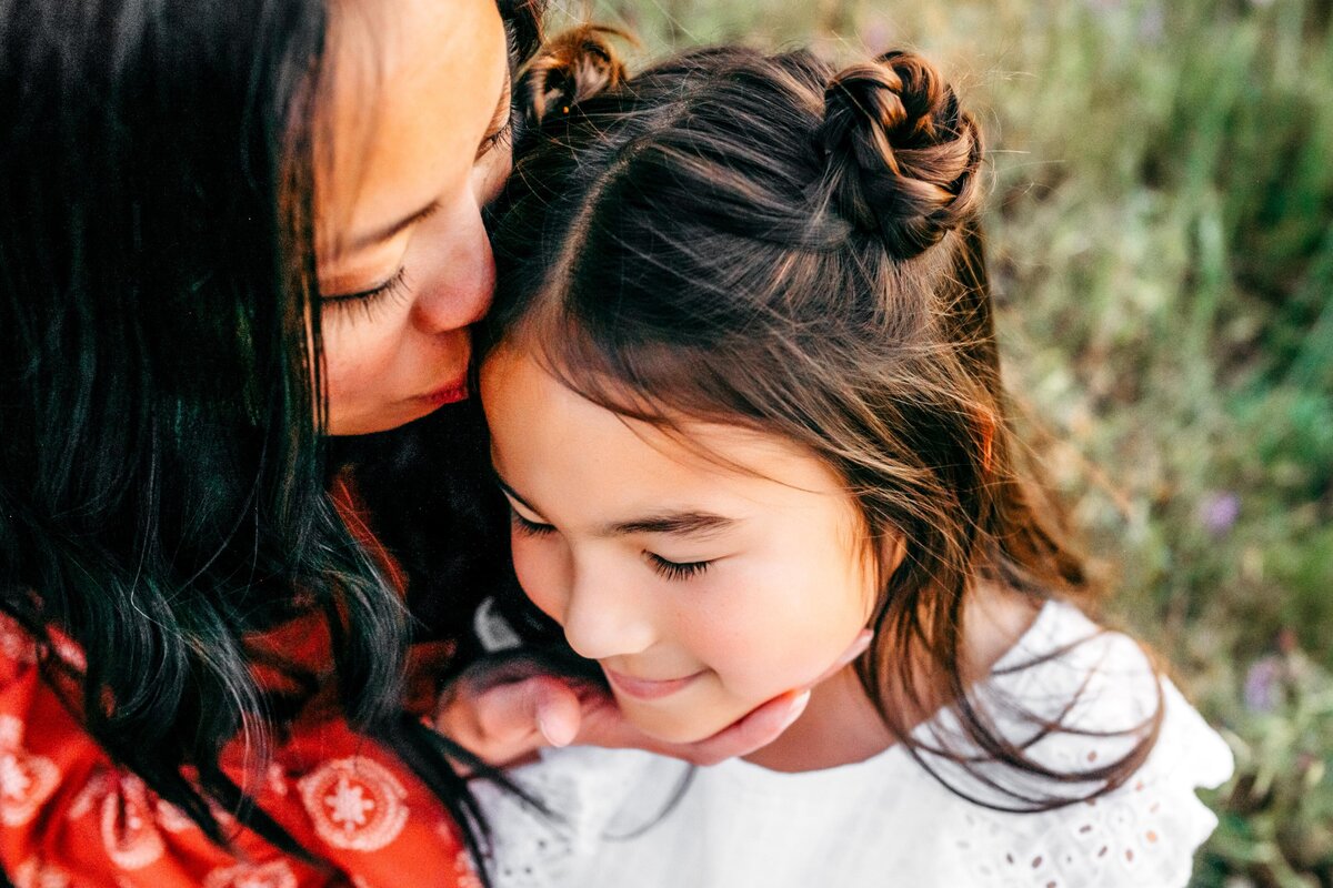 mom-kissing-daughter