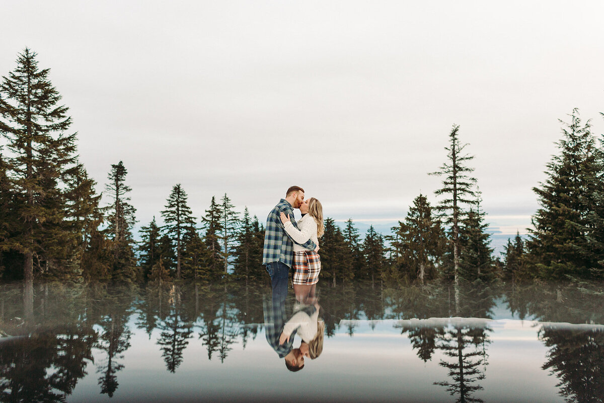 Utah Wedding Photography capturing bride and groom standing by forest
