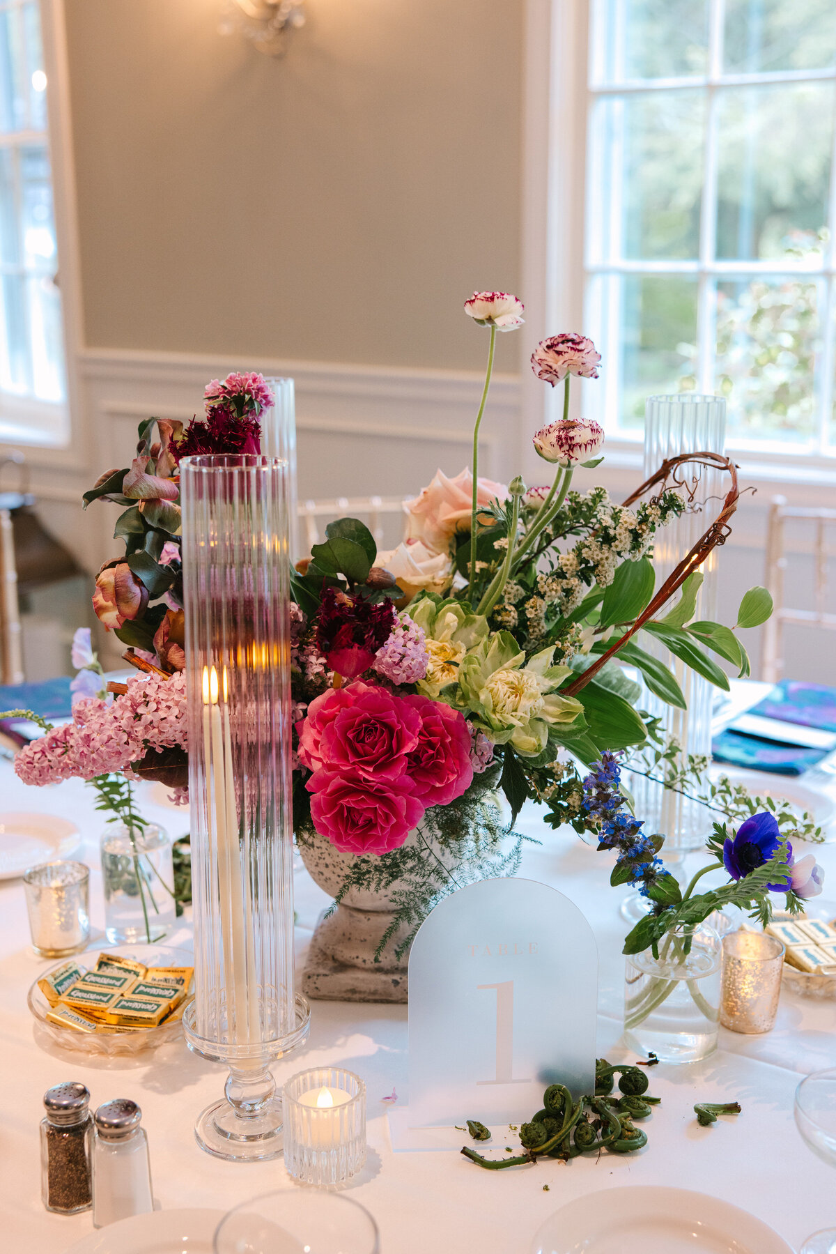 Close up of wedding tablescape of pink and purple flowers