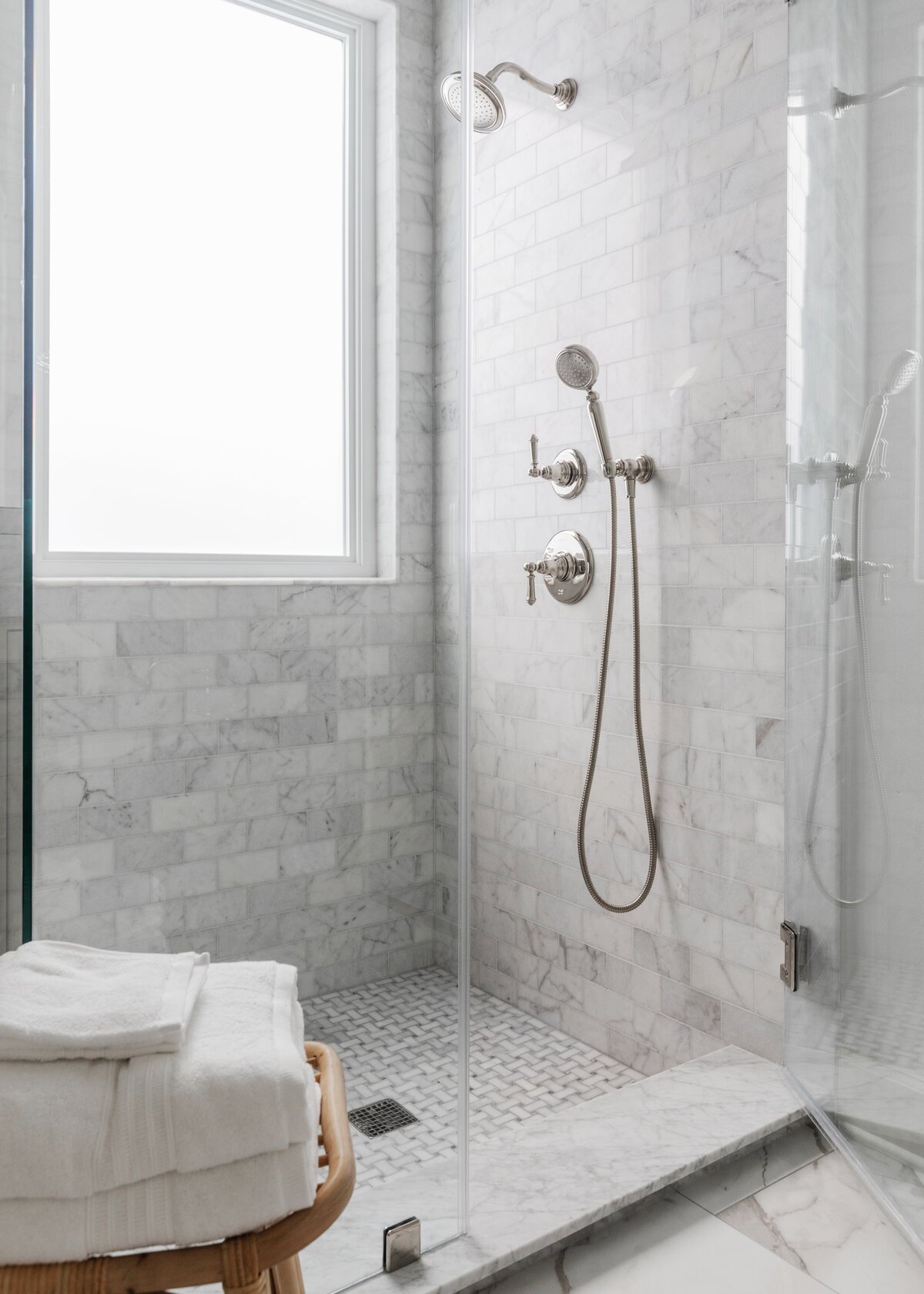 oyster creek studios oak forest remodel gray tiled shower with glass doors in bathroom