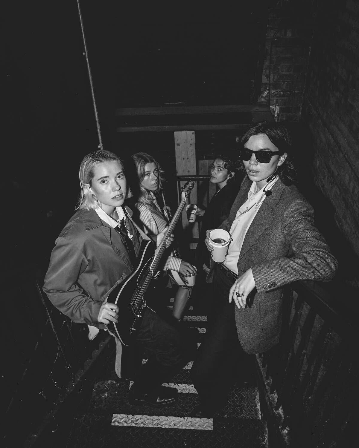 The Aces stood on stairs looking up