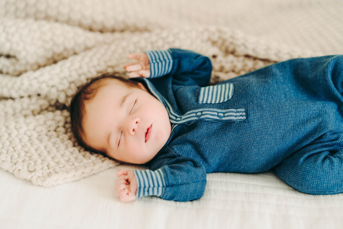 baby boy sleeps during newborn session in jackson missouri