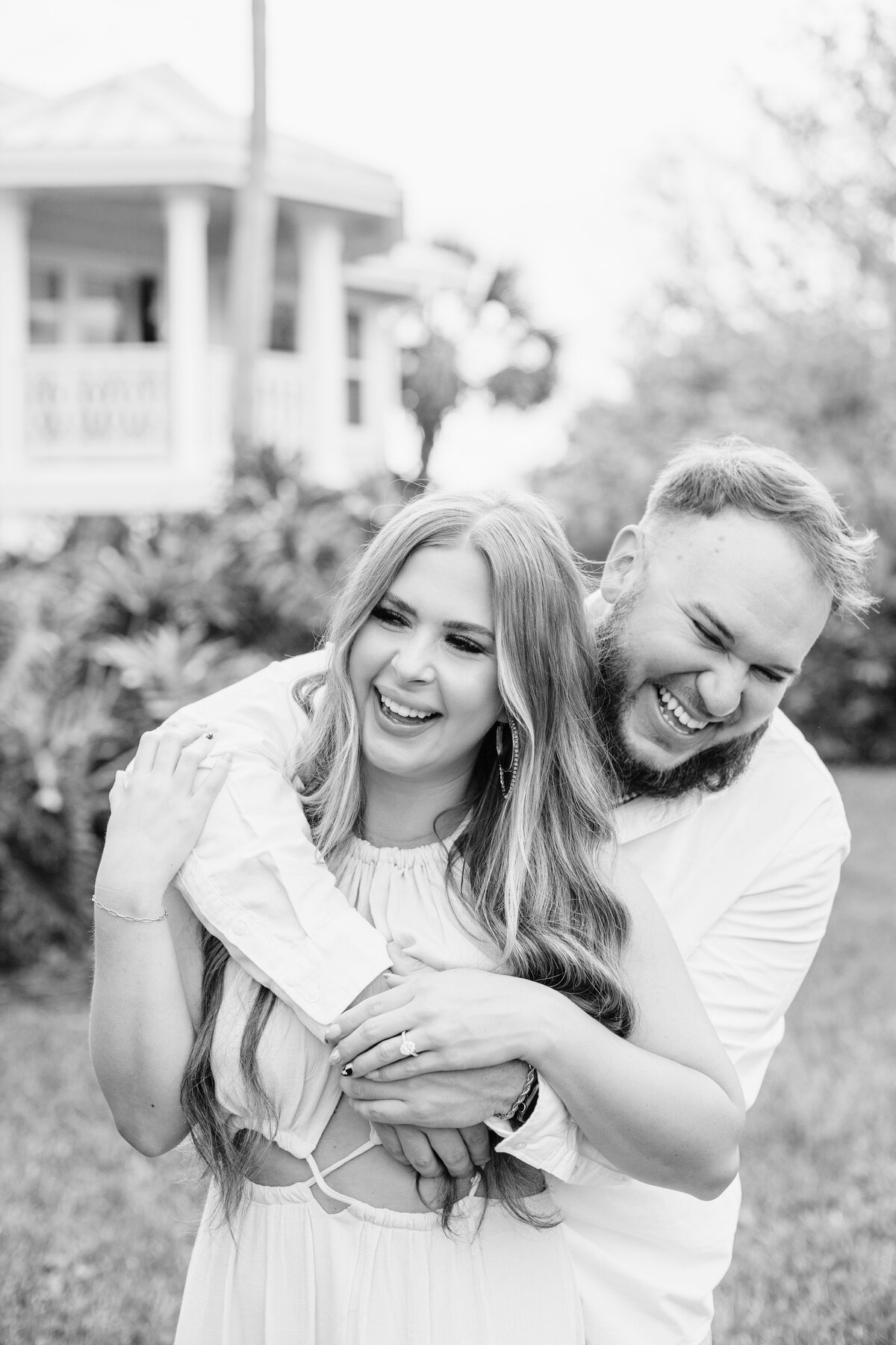 Playful couple during engagement photo shoot at Disney's Grand Floridian