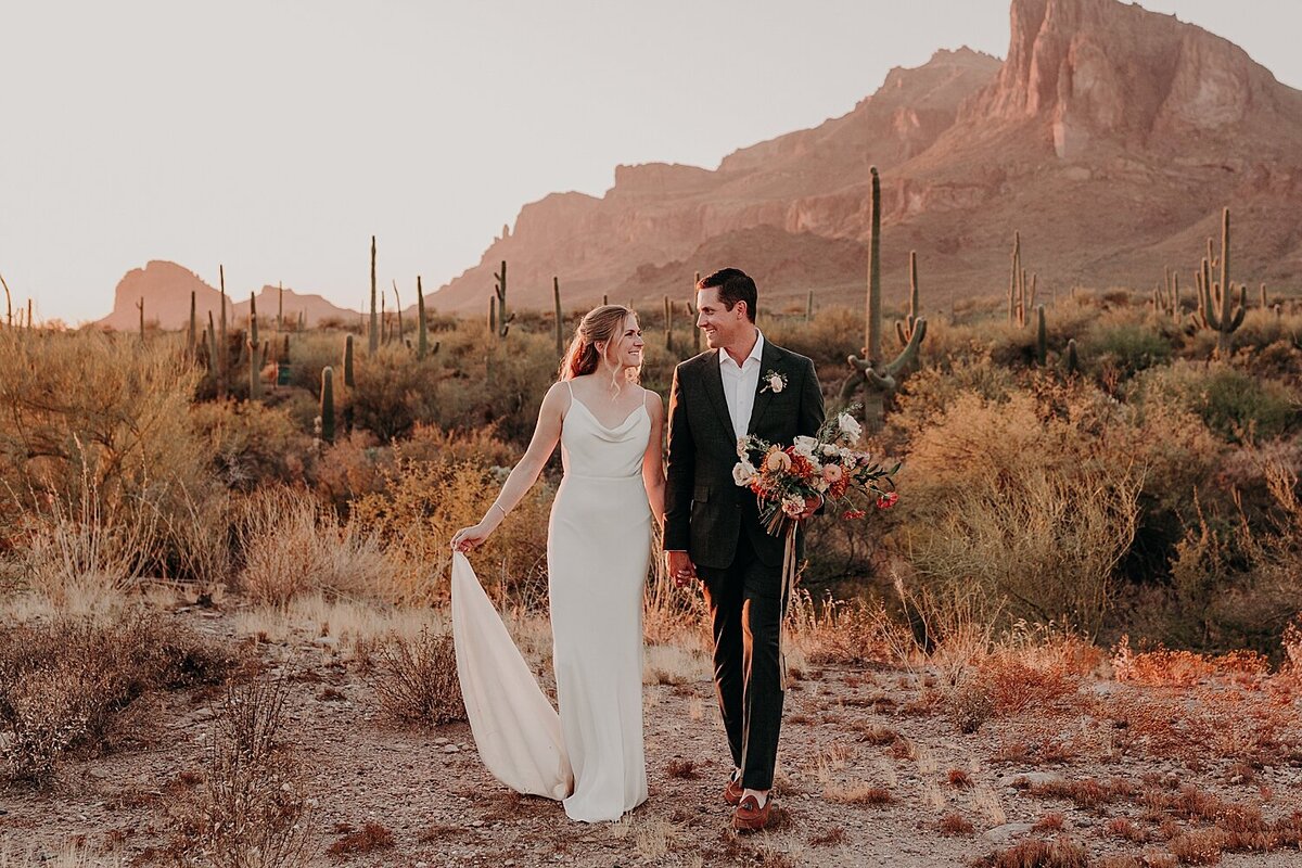 Phoenix wedding couple walking in the desert at sunset