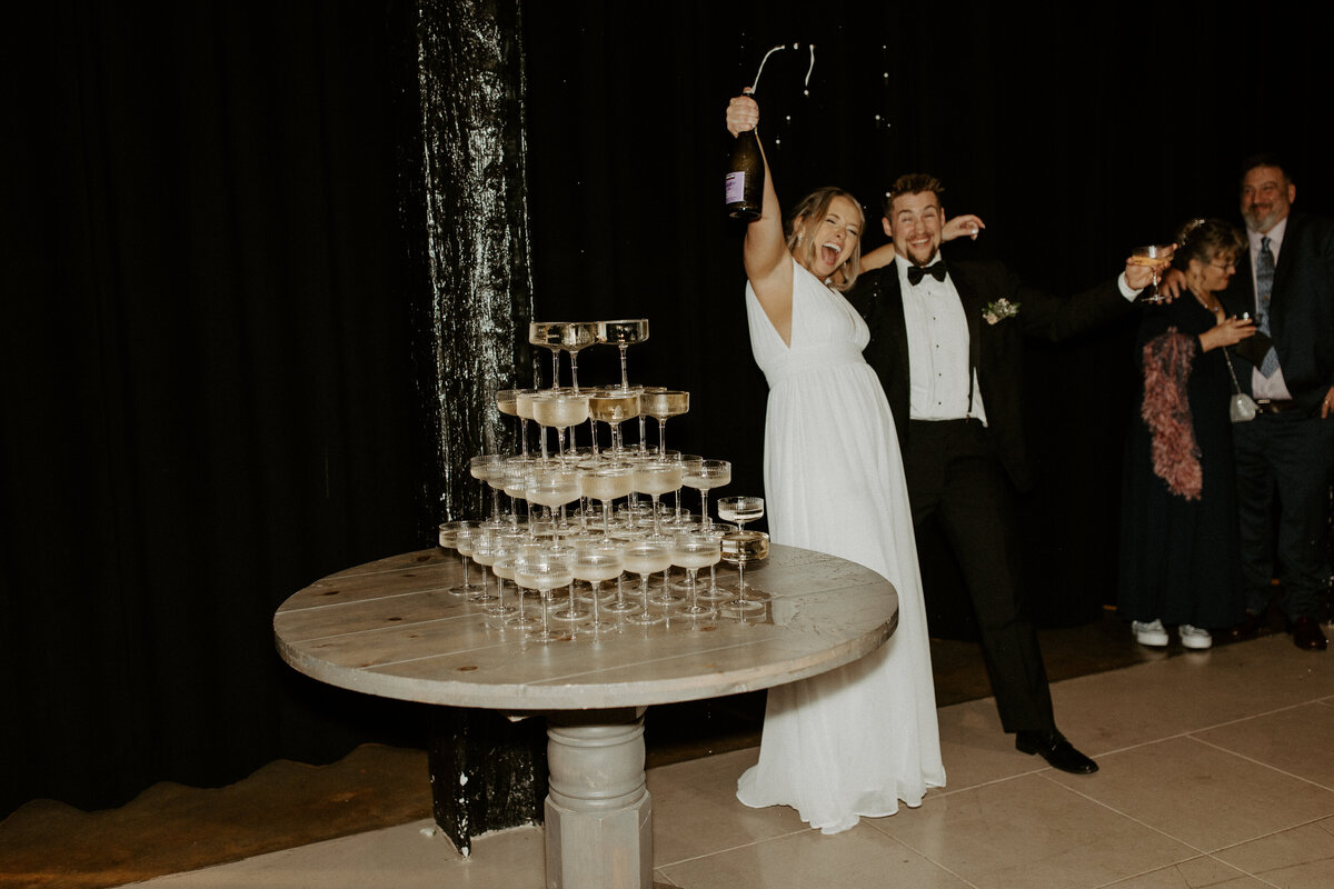Champagne tower with bride and groom by Richmond Virginia wedding photographer