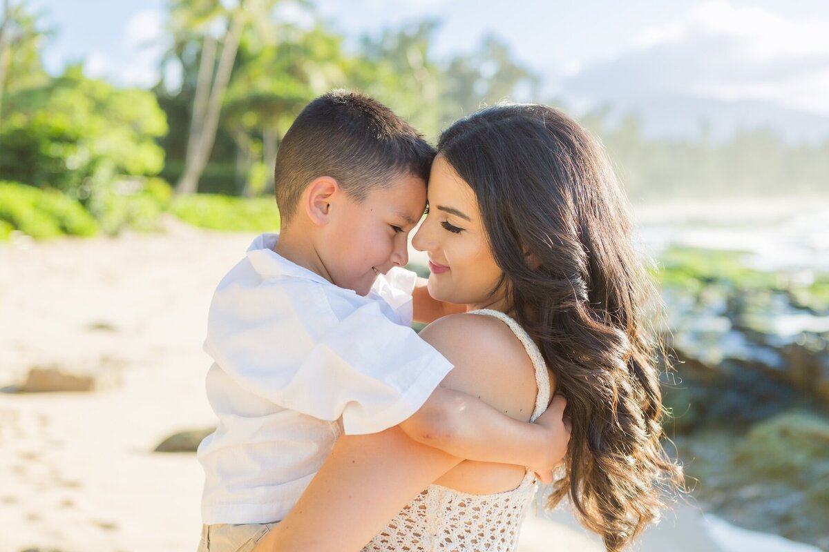 Photo of Mom and little boy hugging taken by Oahu family photographer Karma Hill Photography on the North Shore. 