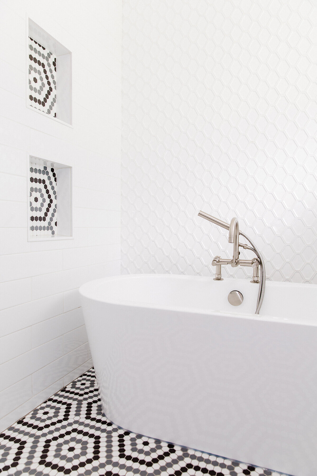 Fresh, modern bathroom remodel with freestanding tub and hex tile floor - desi