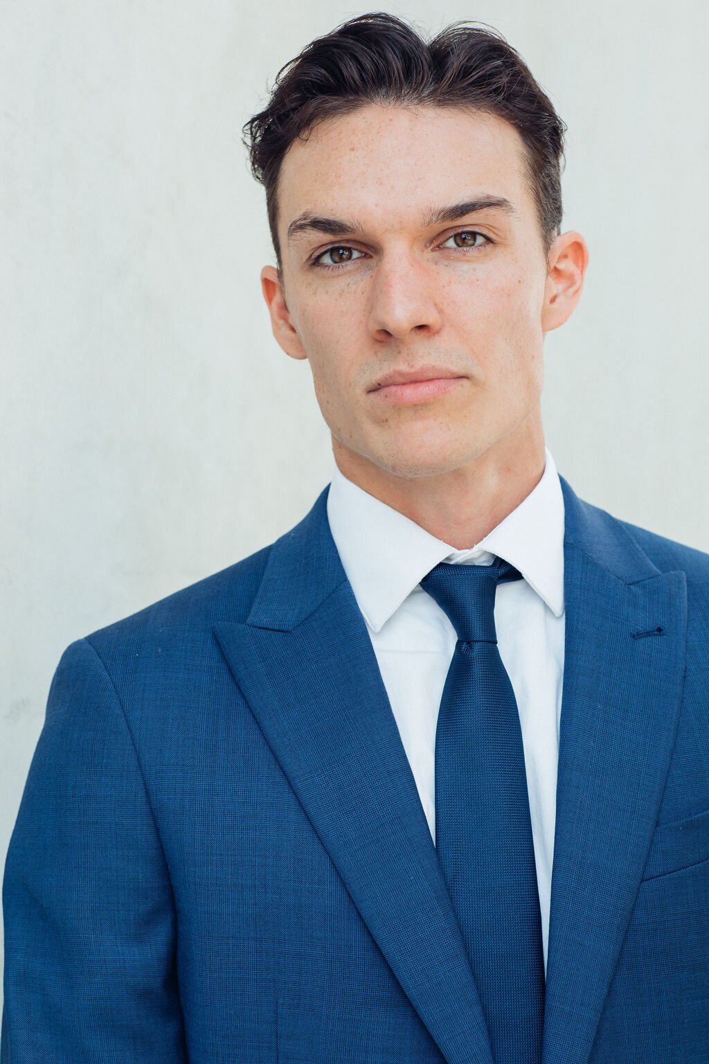 Young Man Wearing Blue Suit with Blue Necktie Headshot in LA
