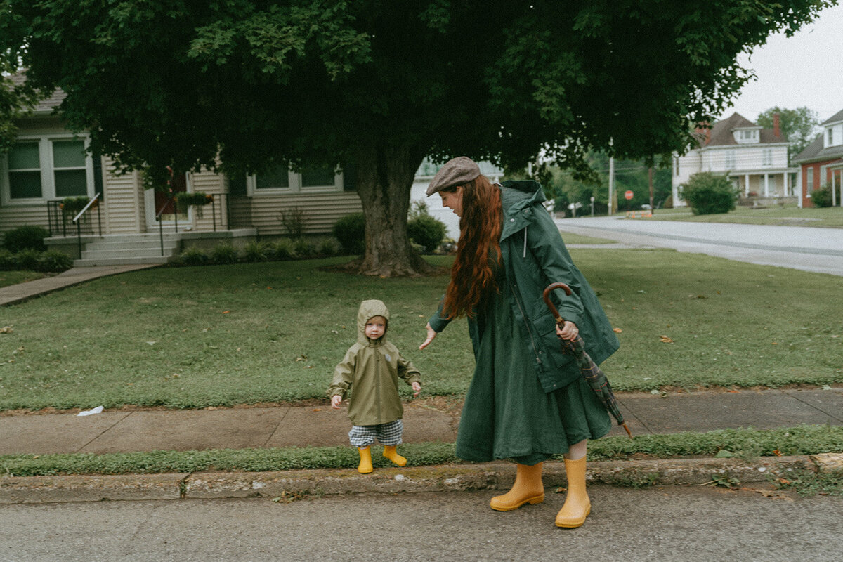 mom holding out hand to son during family photoshoot captured by NYC family photographer Elsie Goodman
