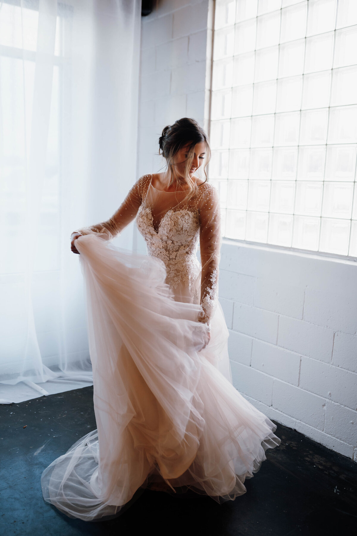 bride in wedding dress twirling