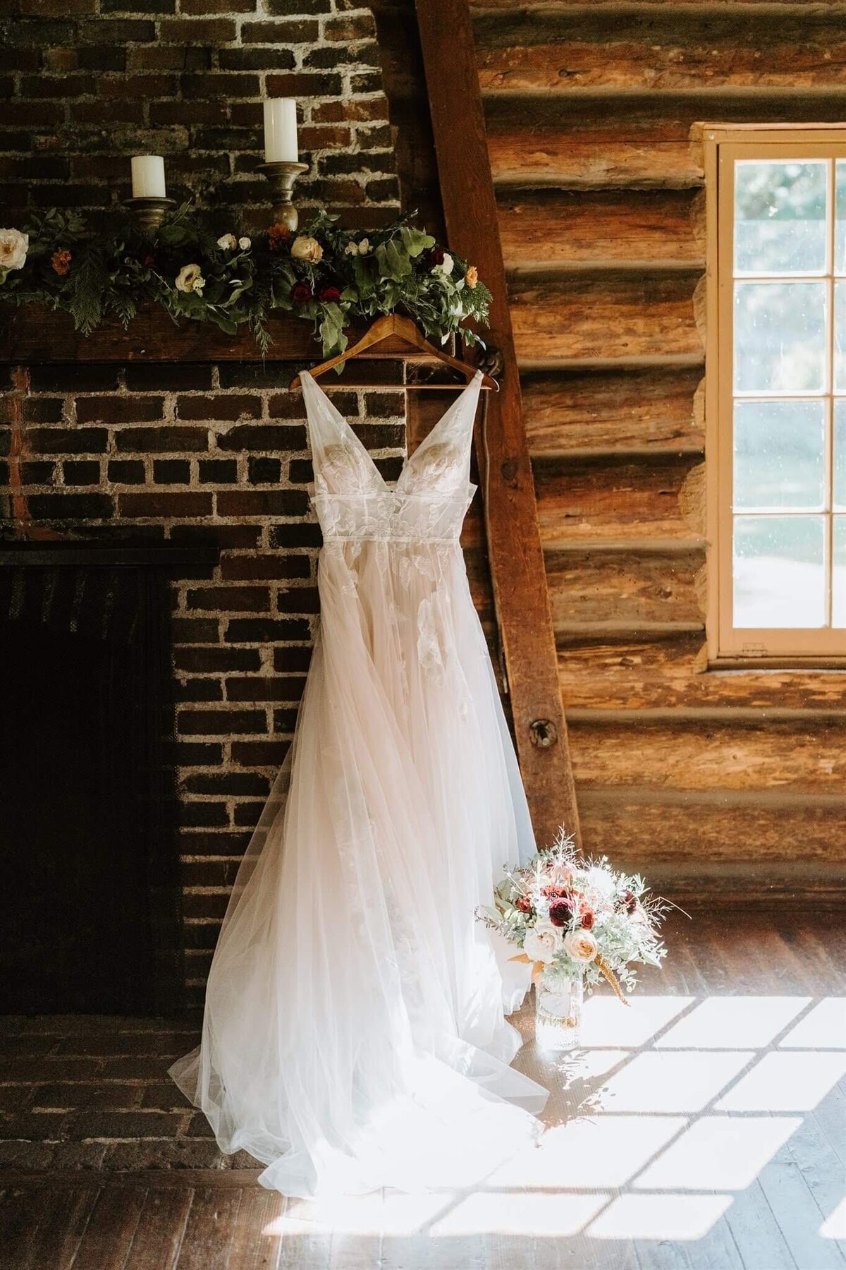 Wedding dress with bouquet resting nearby.