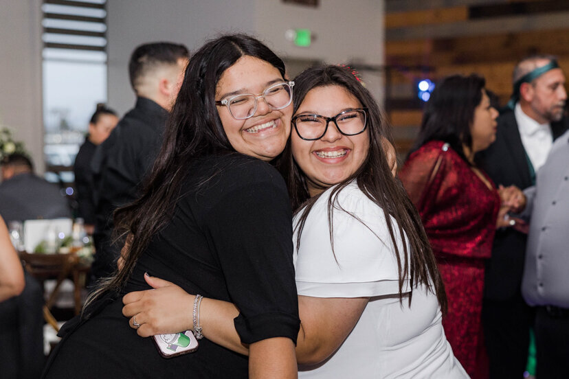 sisters-hugging-dancing
