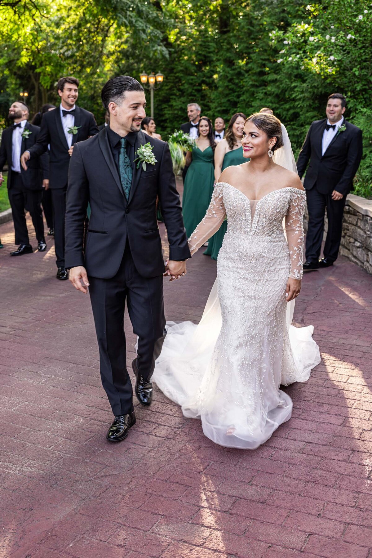 bride-groom-looking-at-each-other-wedding-party-smiling