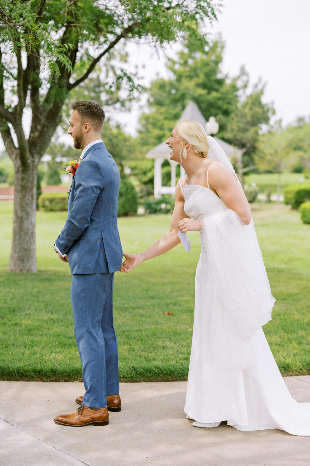 bride-pinching-grooms-butt-first-look