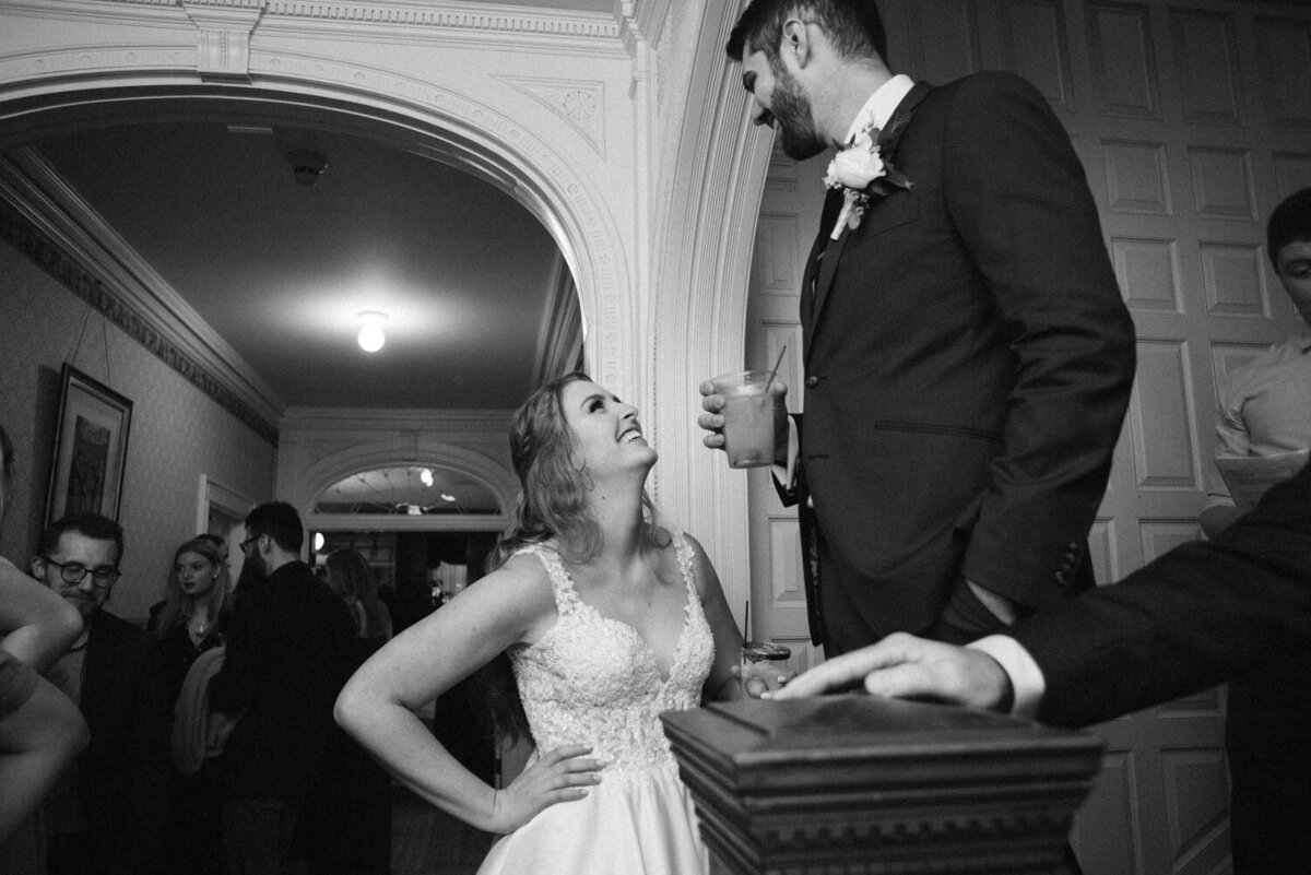Black and white photo of bride and groom on their wedding reception