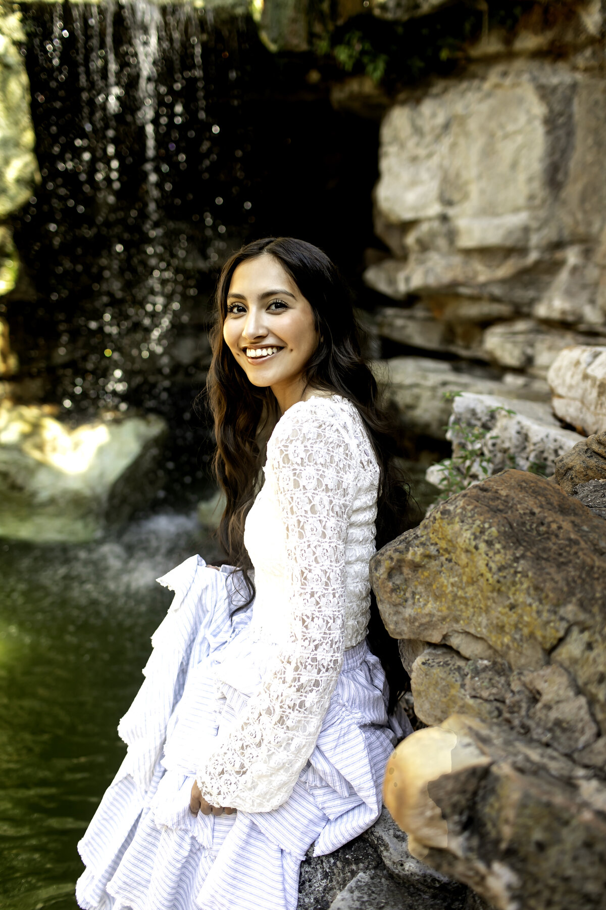 A senior photoshoot at Chandor Gardens, where the picturesque surroundings and floral beauty highlight the graduate's poise and excitement for the future