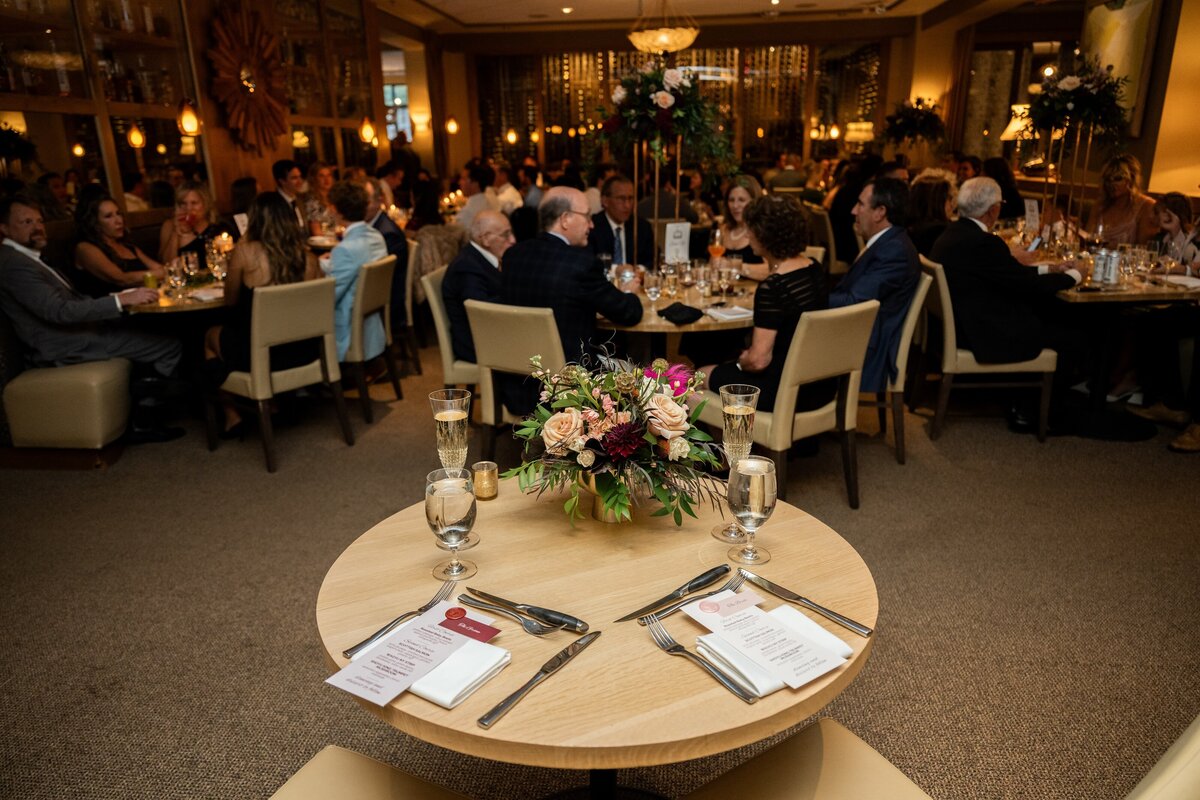 Guests at dinner during a wedding reception in Vail, Colorado.