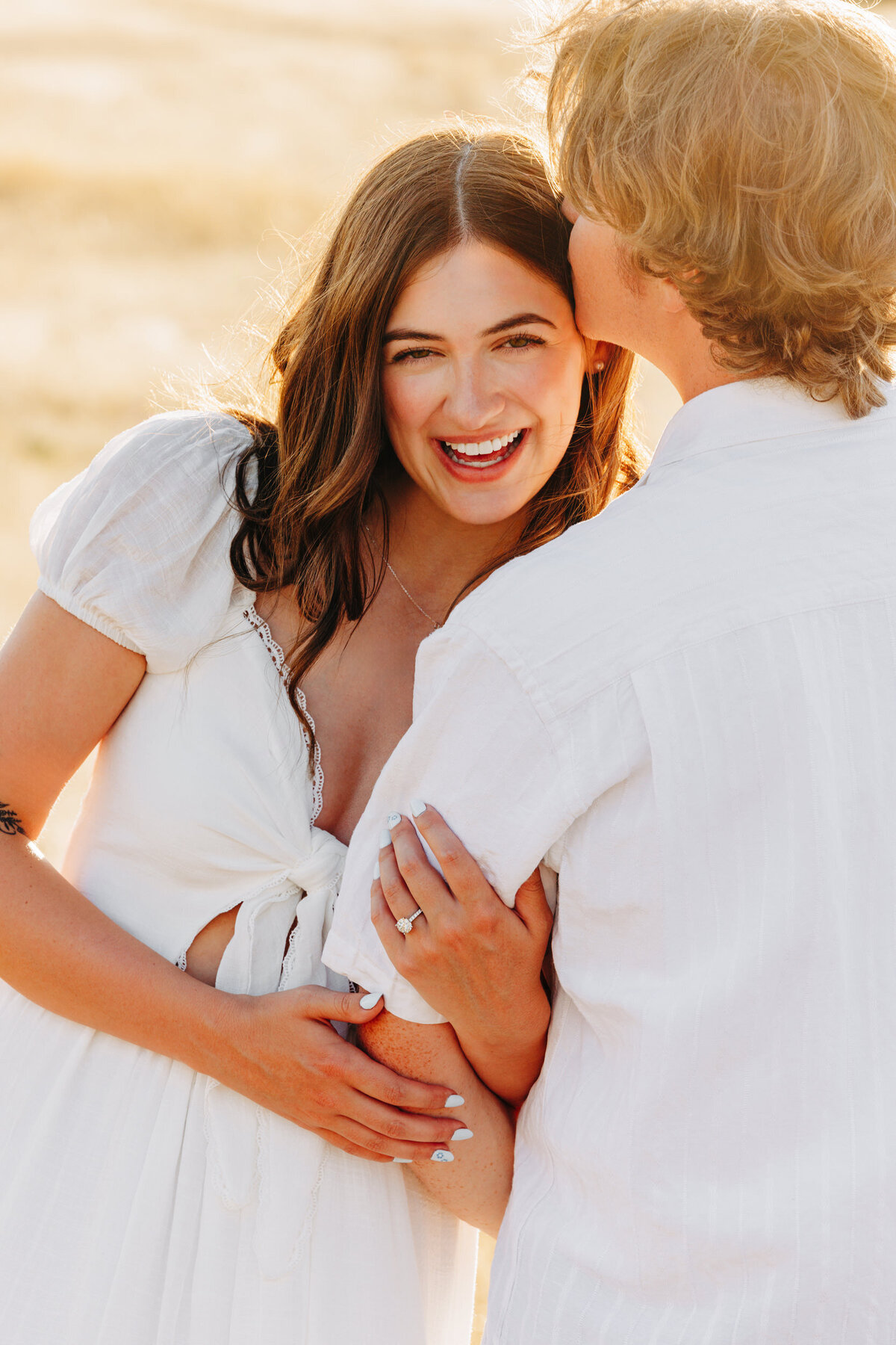 Happy engagement photo couple smiling at Blue Mountain in Missoula