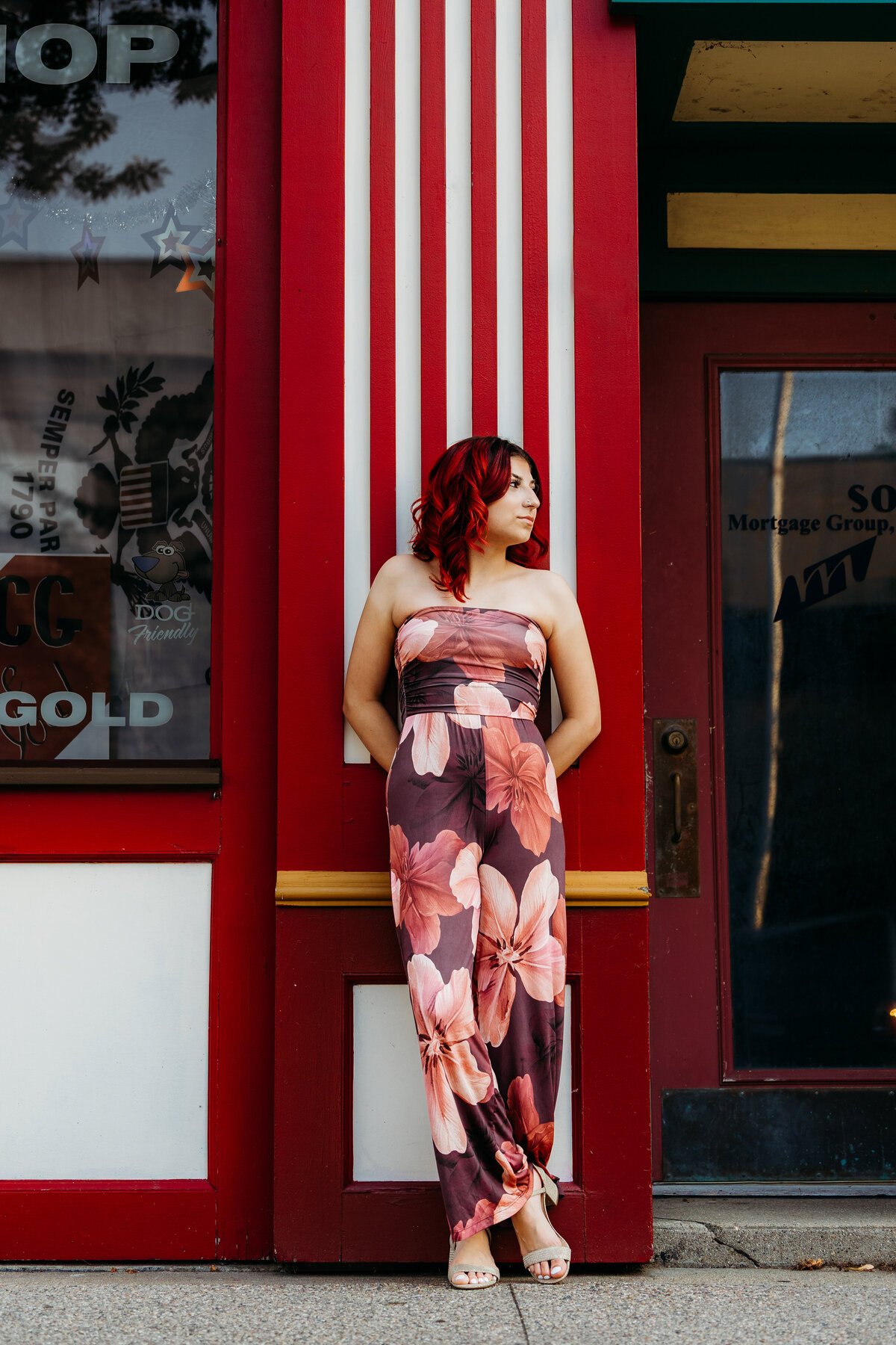 teen-leaning-on-red-and-white-wall