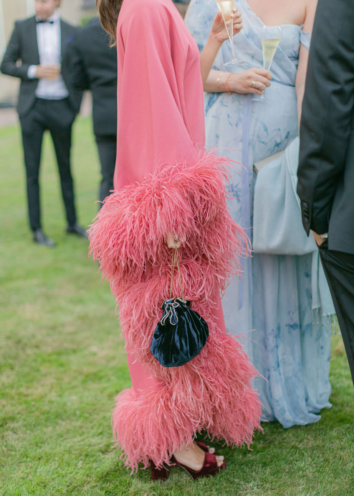 chloe-winstanley-weddings-cocktail-hour-pink-feather-dress