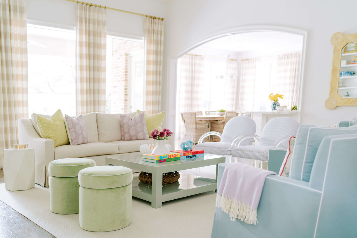 oyster creek studios hause green blue and white ottomon and sofa chair in living room