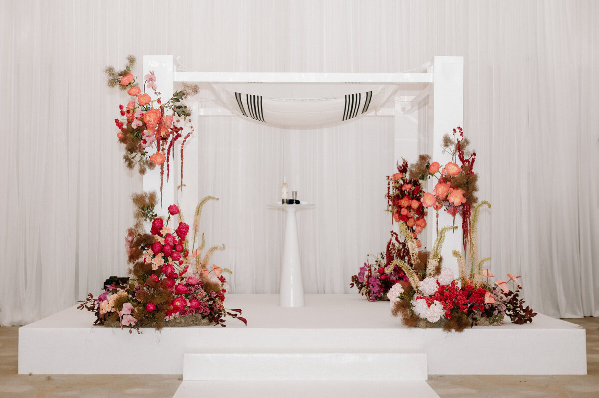 A minimalistic floral chuppah setup for a modern Jewish wedding ceremony in downtown Toronto.