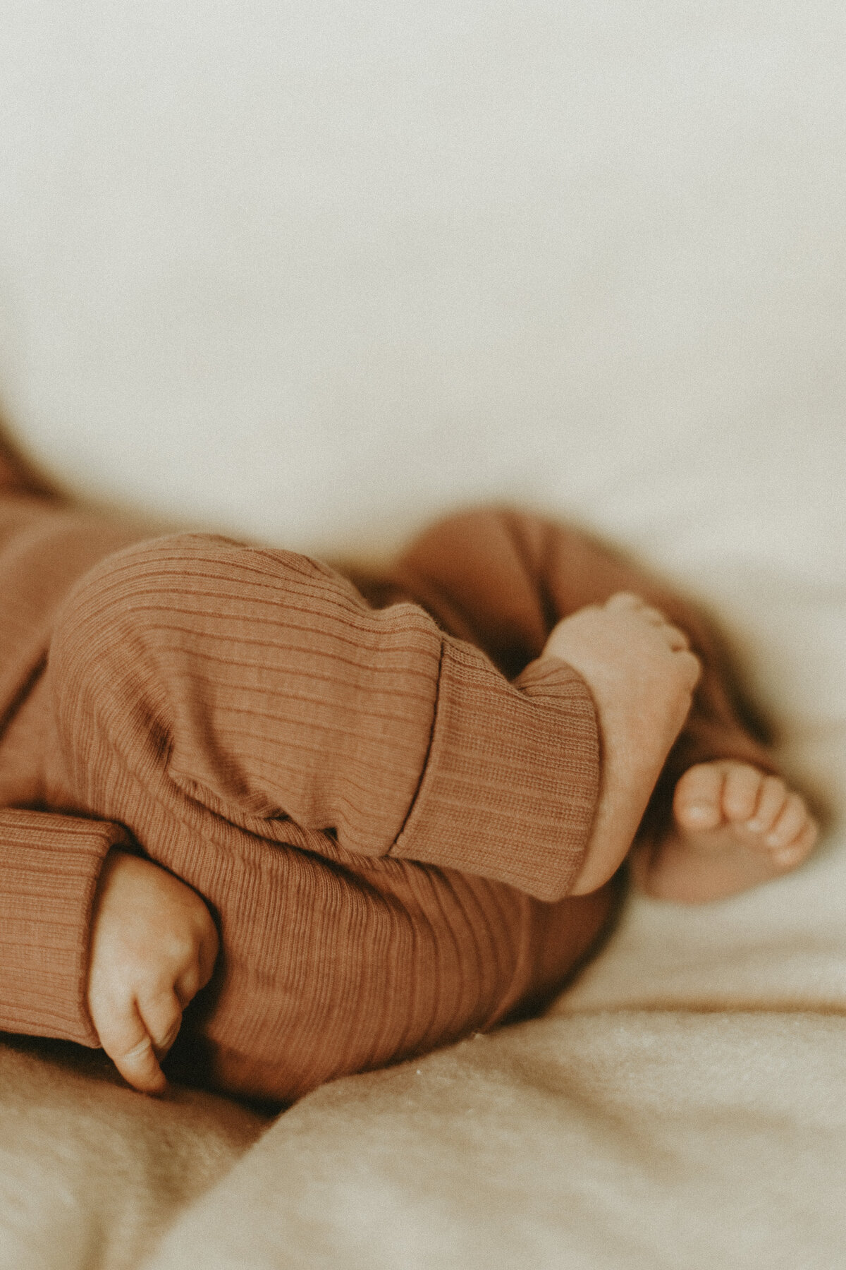 modern newborn photo of a baby's bum and toes