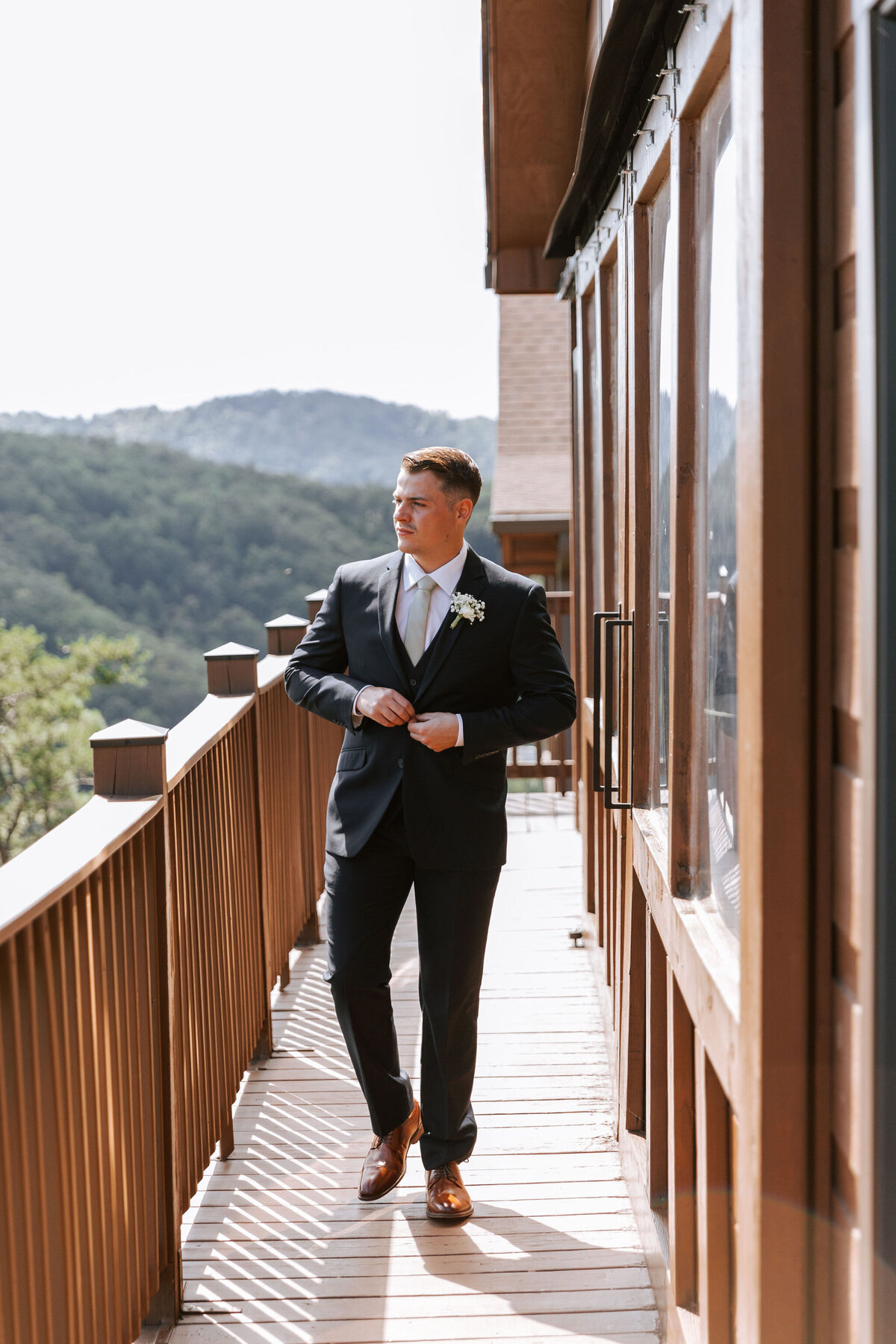 destination-wedding-venues-mountains-groom-suit