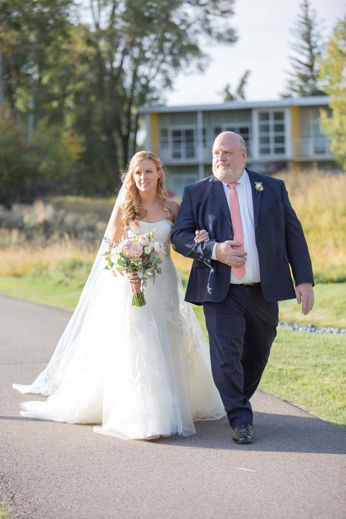 fall-aspen-meadows-ceremony-bride-walks-down-aisle