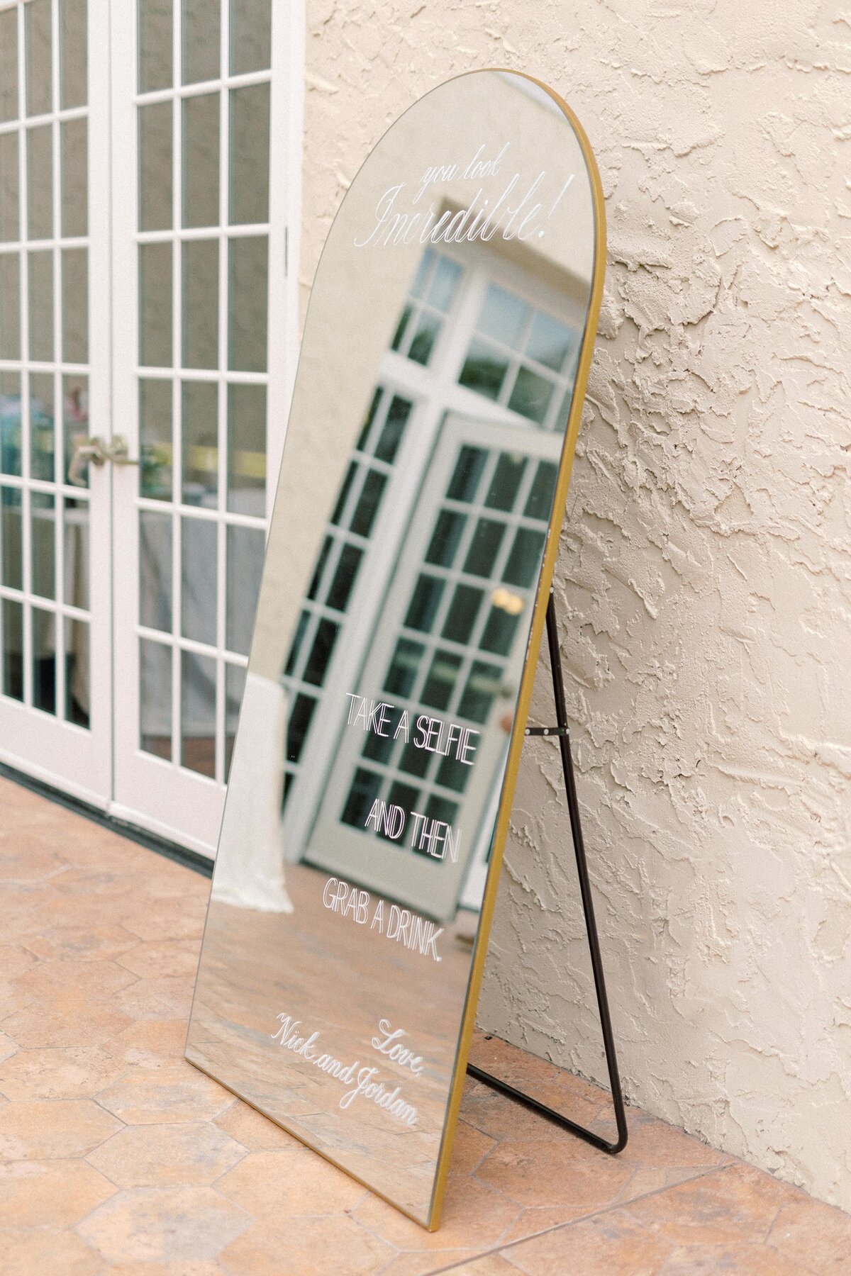 Large gold arch mirror with calligraphy for selfie sign