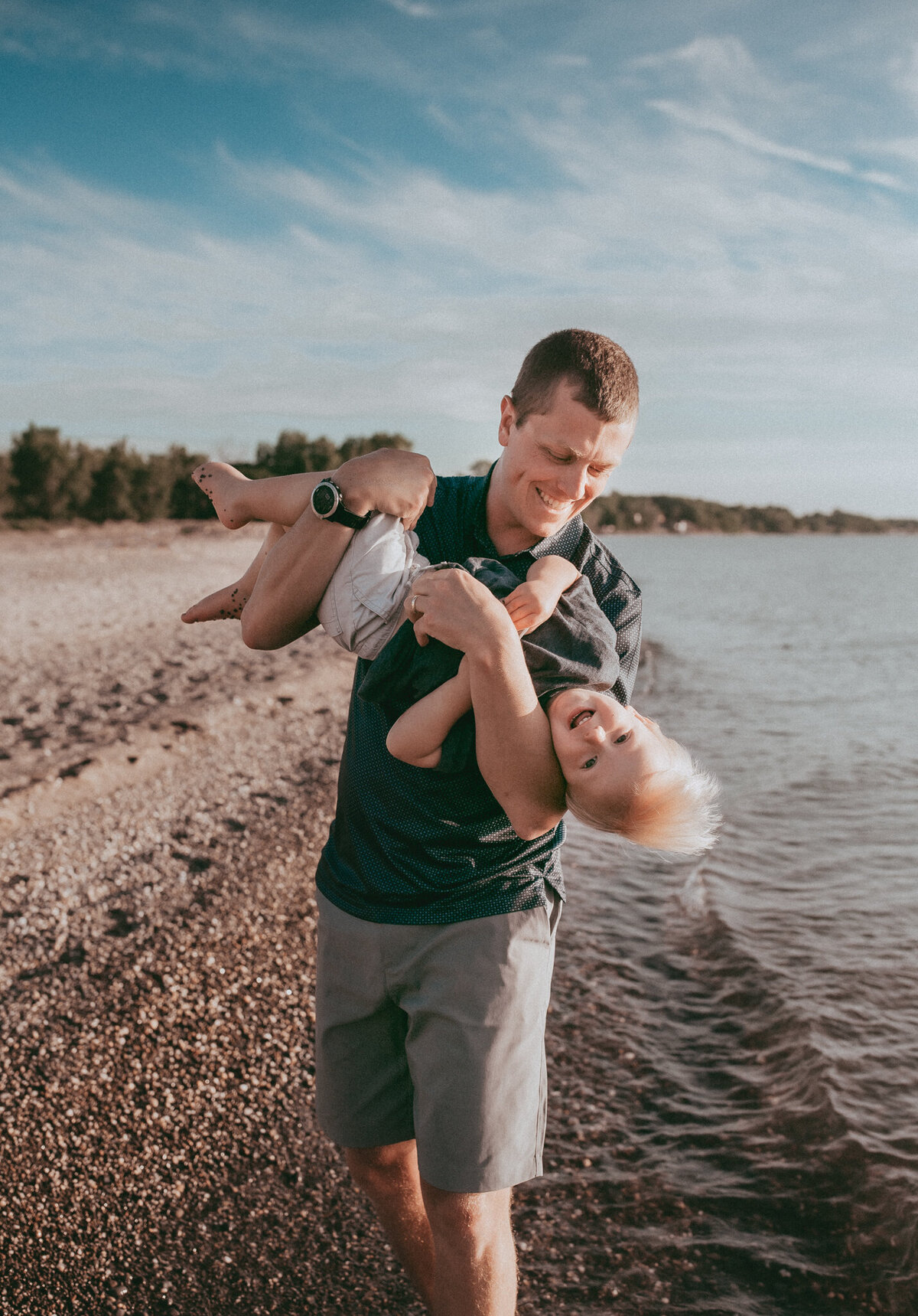 dad playing with young son