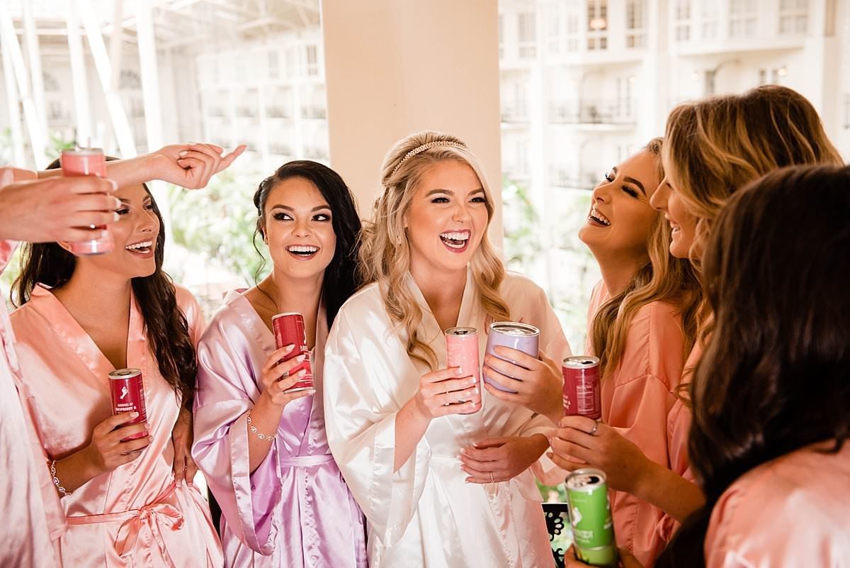 Bride with bridesmaids drinking Barefoot wine spritzers