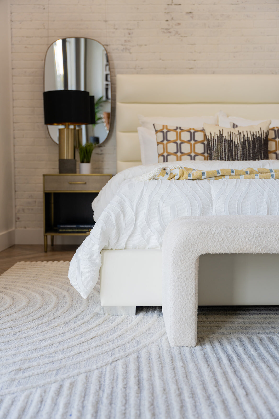 Bedroom with white black and gold accents