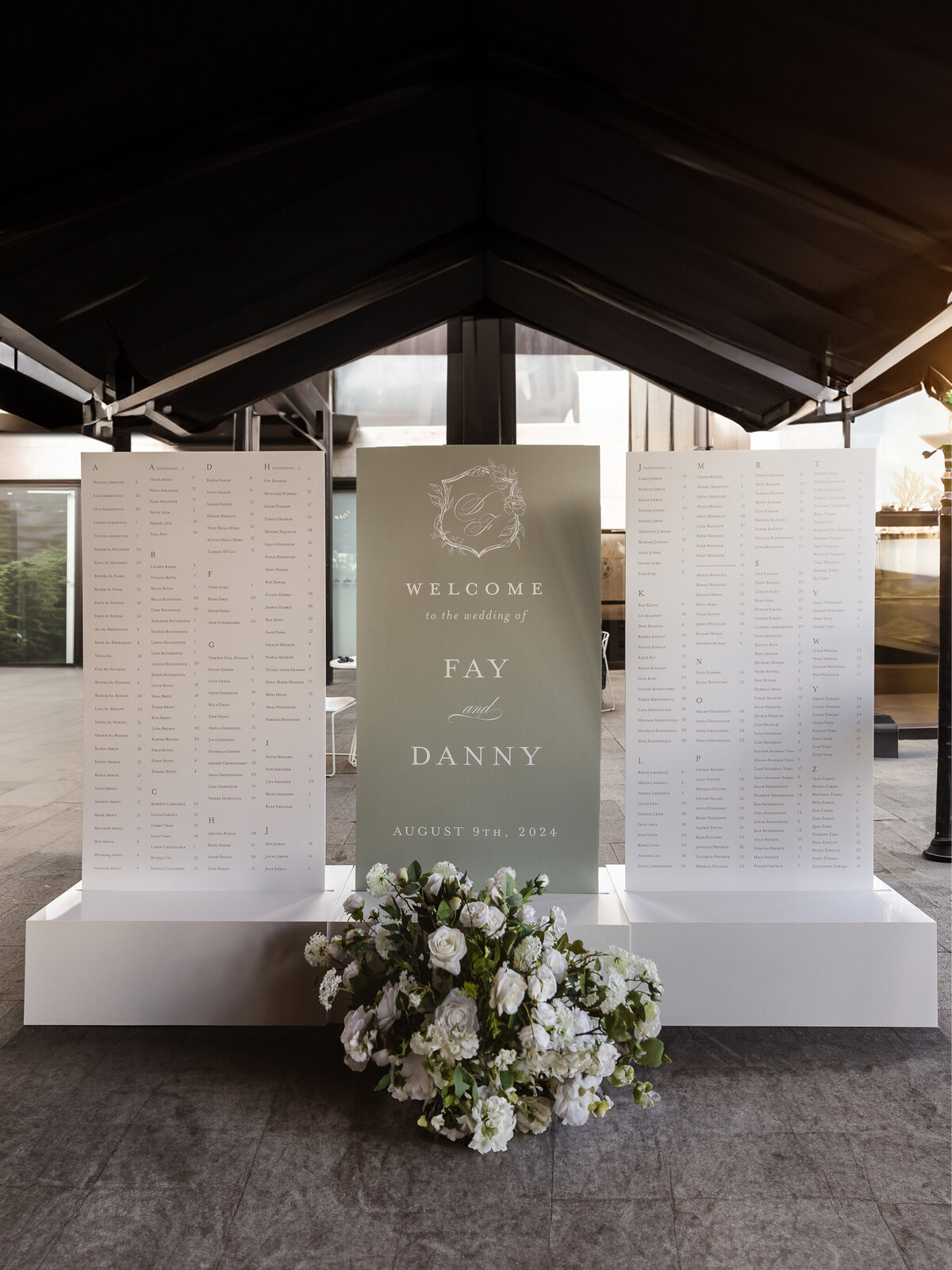 Three Large Wedding Escort Seating Signs in White Acrylic Bases