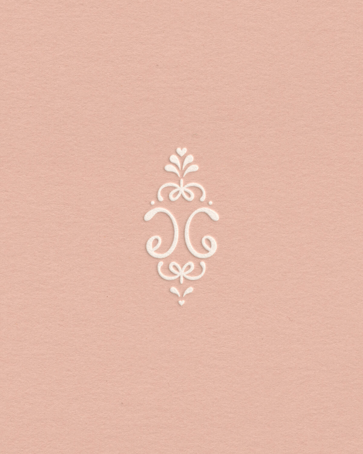 Soft blush brand mark with ornate monogram design for timeless, luxury-inspired photo brand identity