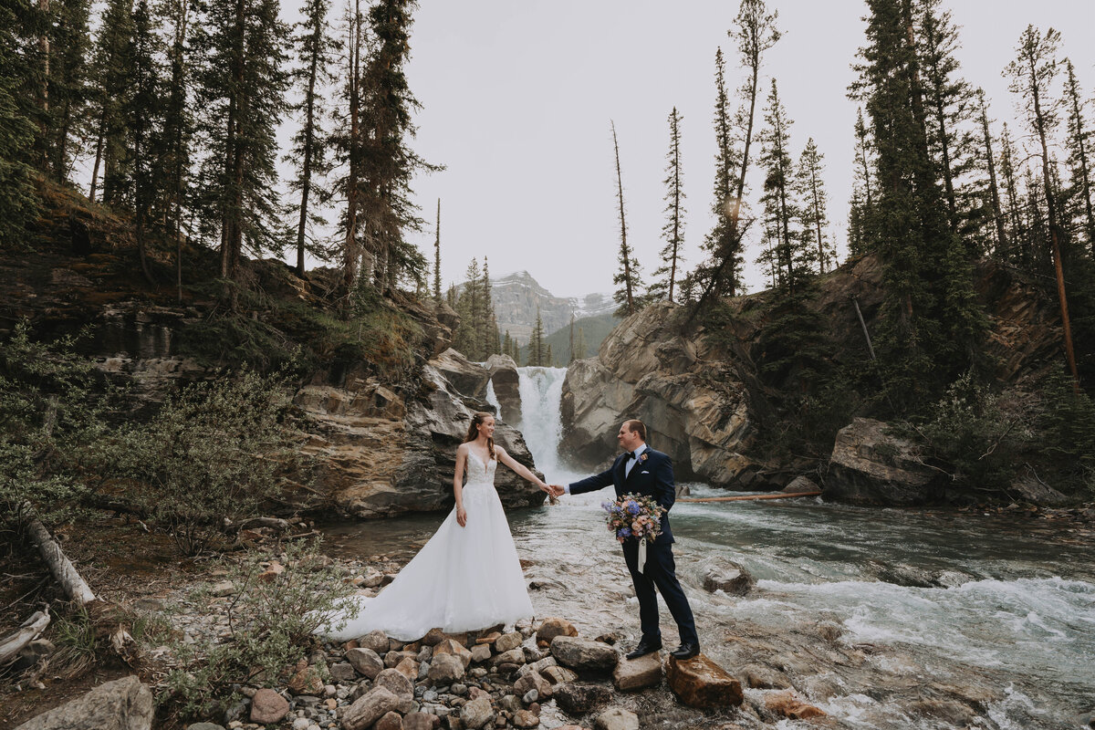 Eloping couple on top of a mountain at Rockies Heli Alberta