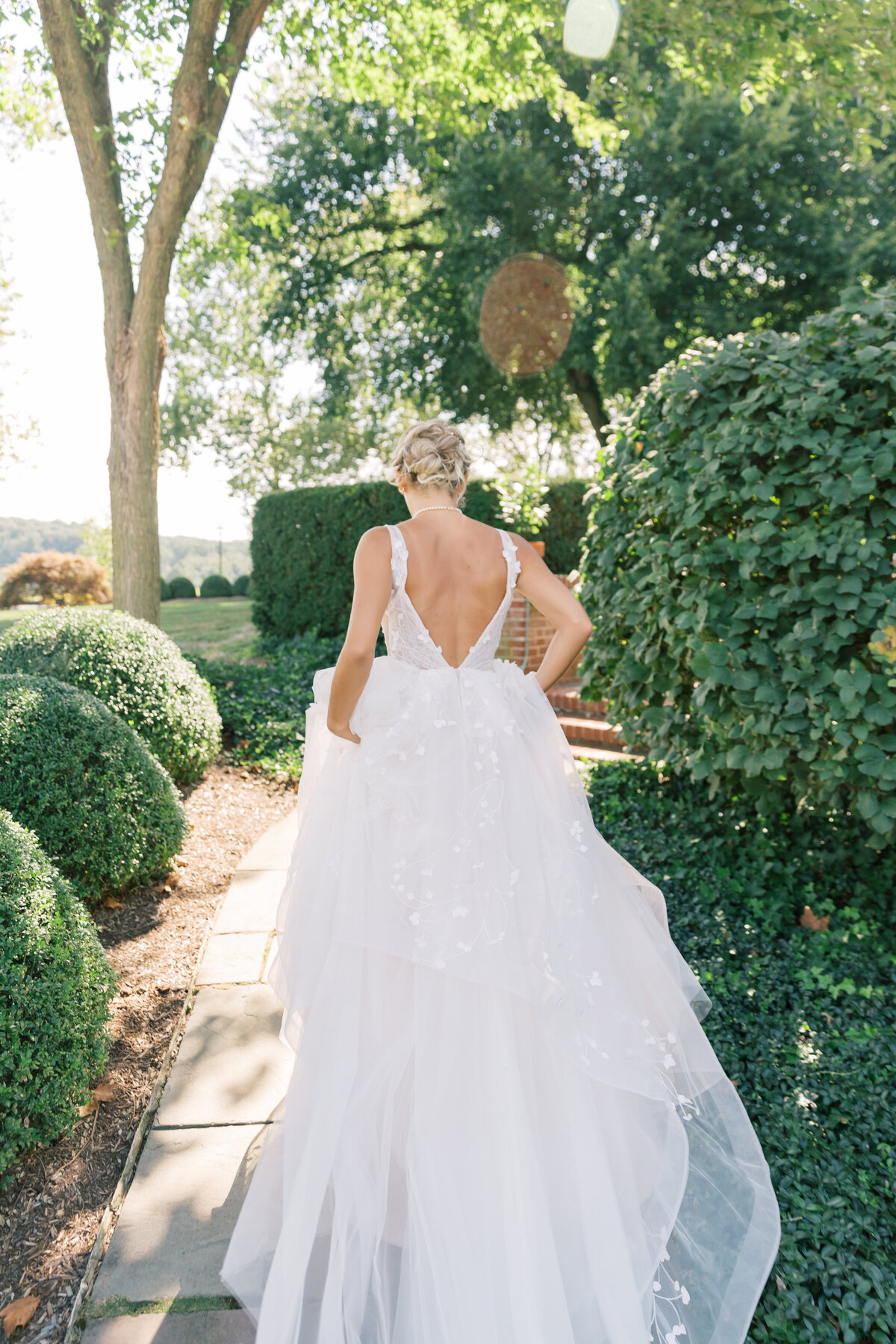 Bride running away from camera at Drumore Estate